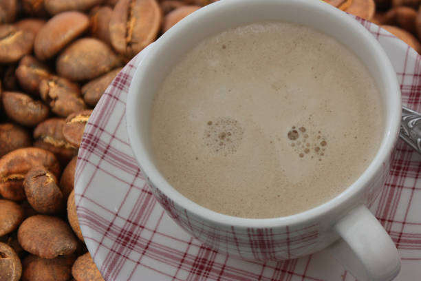 istock Coffee with milk  Cappuccino  Roasted coffee beans 1221781119