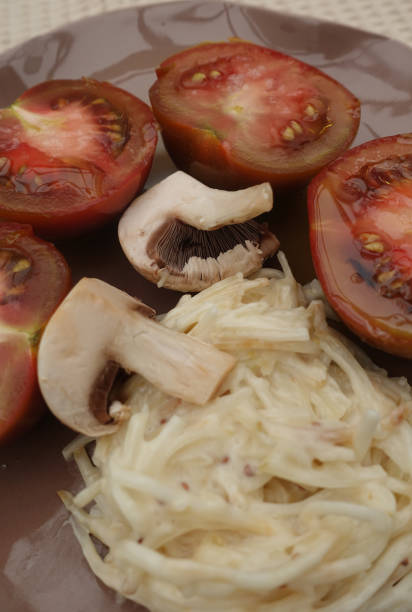 istock Crimean black tomato cut in half  Celery remoulade  Paris mushroom Appetizers 1221781339
