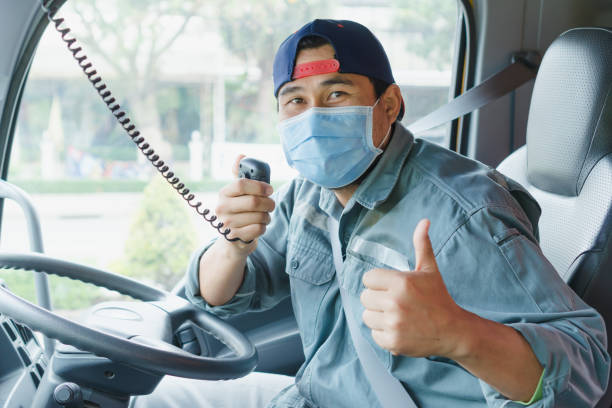 istock Truck driver wearing a mask 1221781395