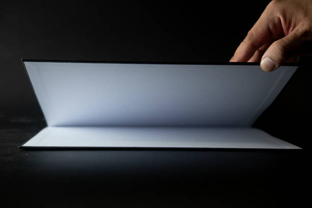 istock Open of empty page with empty for your design on black background 1221781769