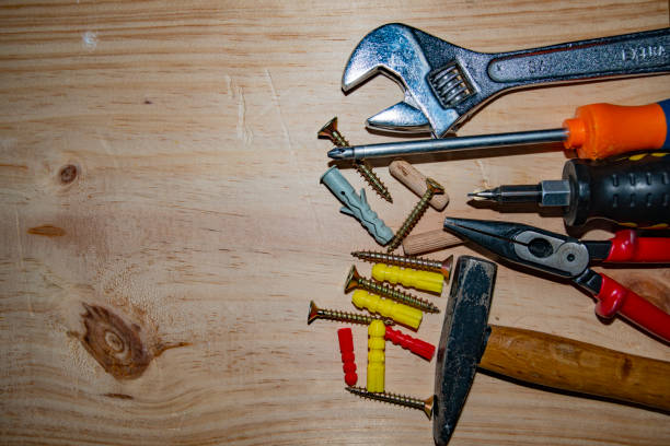 istock Kit of working tools on wooden background 1221782576