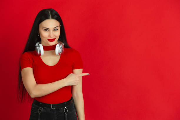 istock Caucasian young woman's monochrome portrait on red studio background, emotional and expressive 1221783078