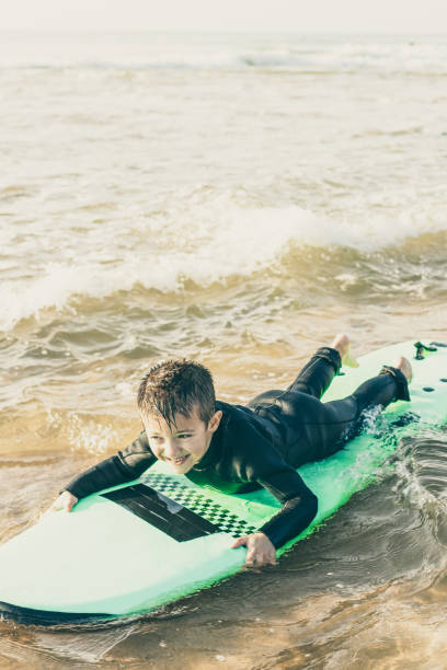 istock Adorable happy child swimming on board 1221784437
