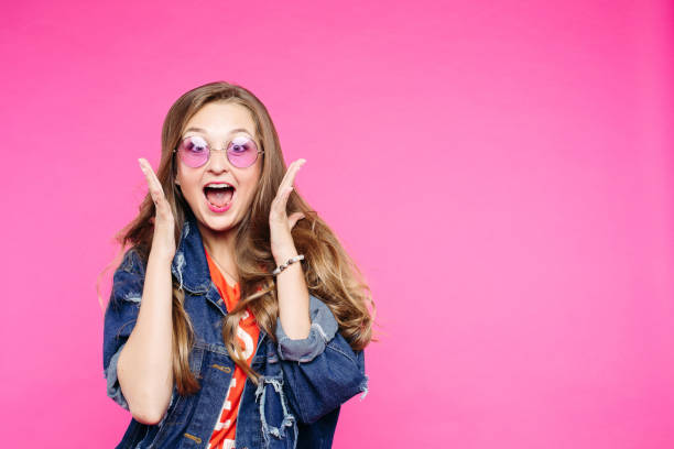 istock Swag girl in pink sunglasses screaming at studio. 1221785598