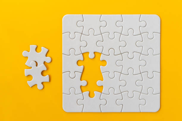 istock Puzzle pieces on orange background. 1221785858