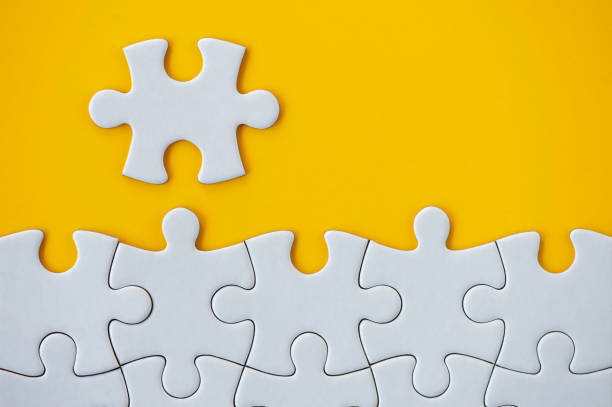 istock Puzzle pieces on orange background. Business background. 1221785959