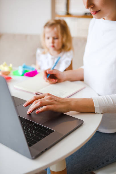 istock Work at home during quarantine. Mom with a child. 1221786039