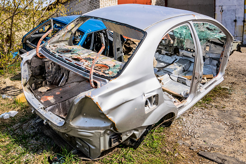 Tambov, Russia - April 24, 2020: Shells of old cars dumped in landfil