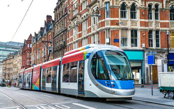 City tram in Birmingham, England City tram on a street of Birmingham in England midlands england stock pictures, royalty-free photos & images