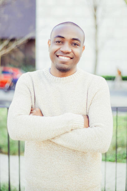 istock Front view of cheerful guy standing and looking at camera 1221789719