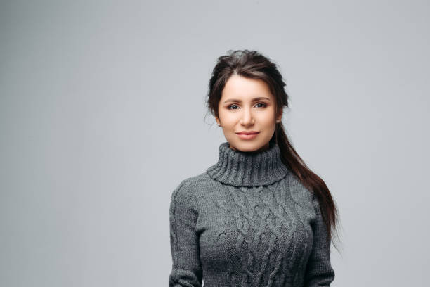 istock Charming young woman with nice smile Isolated on gray background 1221789999