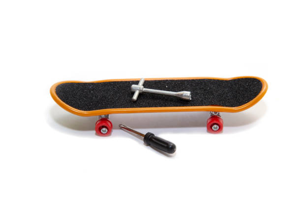 istock mini skateboard with screwdriver and wrench nearby. 1221791290