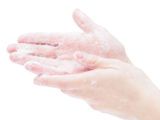 istock Soap hands close-up on a white background. Step-by-step instructions for hand washing. Protection measures against the virus and coronavirus in the pandemic and epidemic of flu and colds 1221792946