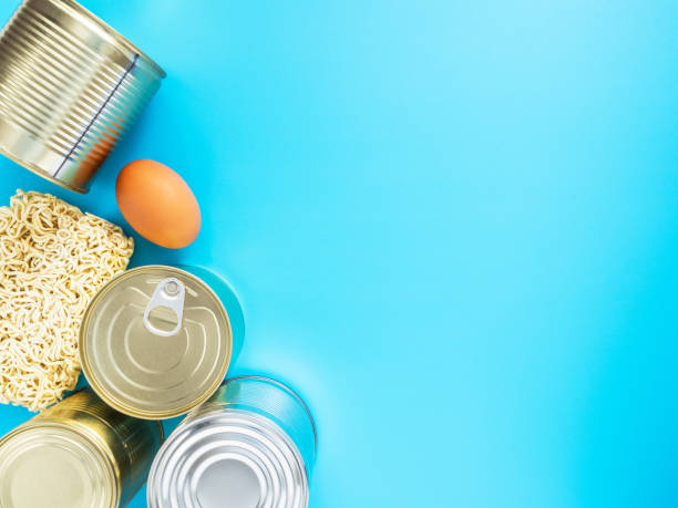 istock Products of fast preparation and long storage isolated on blue background, copyspace. Concept: stocks of food tavars for the period of quarantine in the coronavirus and flu pandemic. Food delivery 1221792954