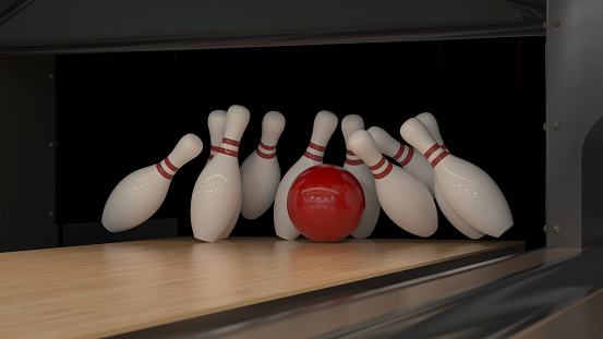 Red bowling strike ball on a wooden track with pins 4k