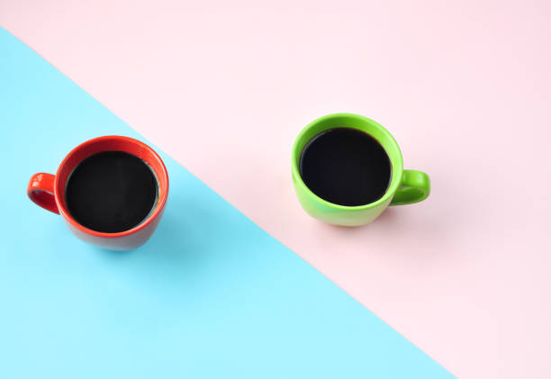 istock Americano in the different cups on the pink background. 1221793996