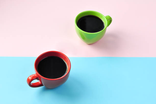 istock Americano in the different cups on the pink background. 1221794032