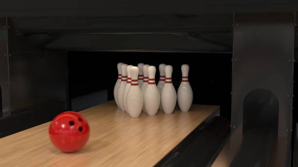 istock Red bowling ball on a wooden track with pins 1221794059