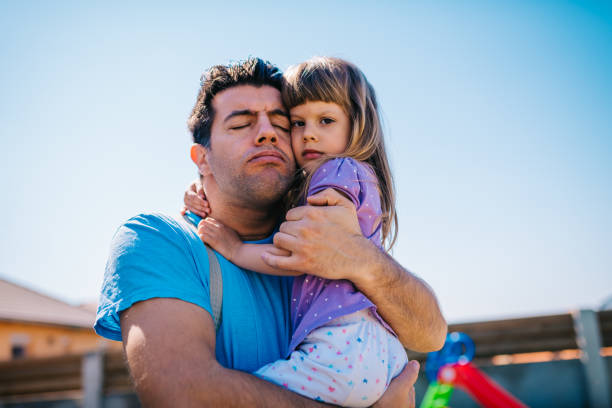 istock Father loving daughter in emotional hug 1221794102