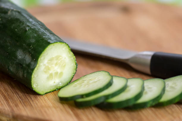 Sliced green cucumber on the cutting board