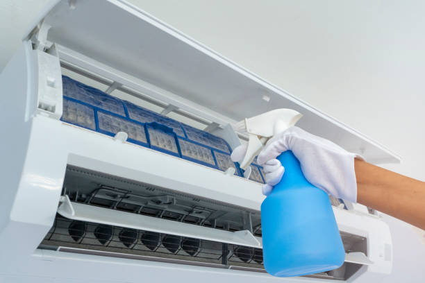 istock Cleaning dirty air filter inside air conditioners.With Water spray bottle 1221795936