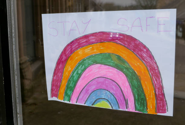 istock Stay safe rainbow drawing in shop window 1221795973
