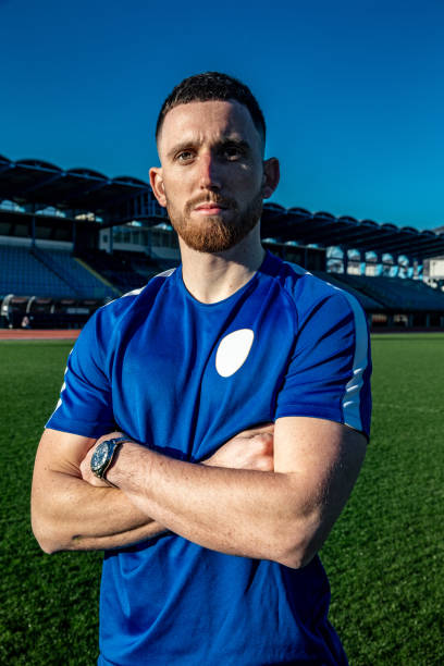 istock Young Soccer player Portrait on the Empty Stadium 1221796966