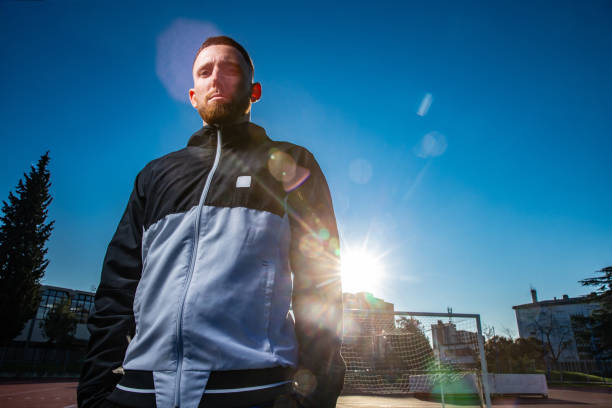 Lone Backlit Soccer player portrait on the playing field