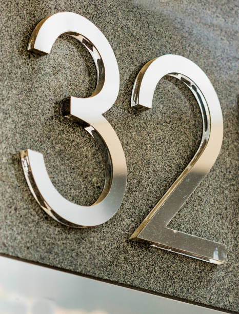 istock Close up of house number 32 1221797630