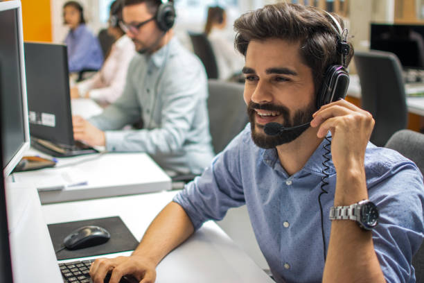 istock Portrait of happy smiling customer support phone operator in headset at office 1221800221