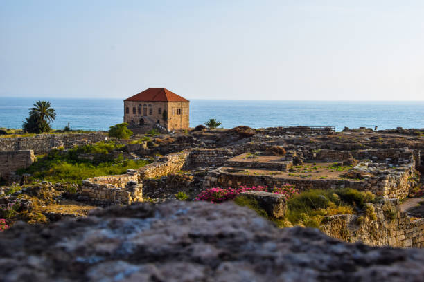 From the top of the citadel in Jbeil, a landscape shows the typical Lebanese house as well as the entire ancient site. The Mediterranean Sea is part of the scenery. This city is located by the sea.