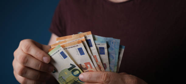 istock money in hand euro banknote 1221802205
