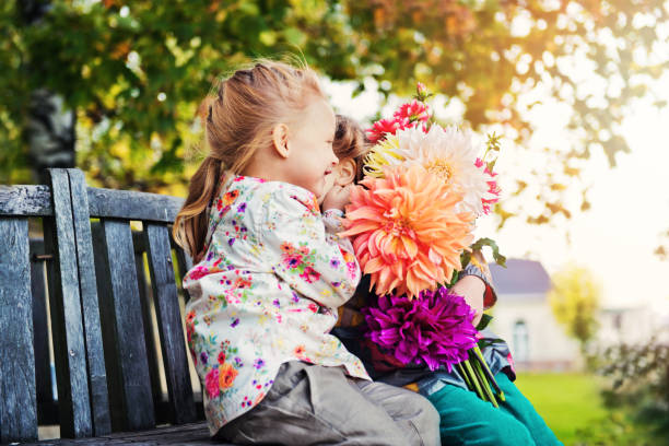 two girls with flowers
