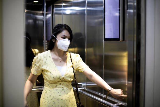 istock asian woman with n-95 mask during quarantine 1221806375