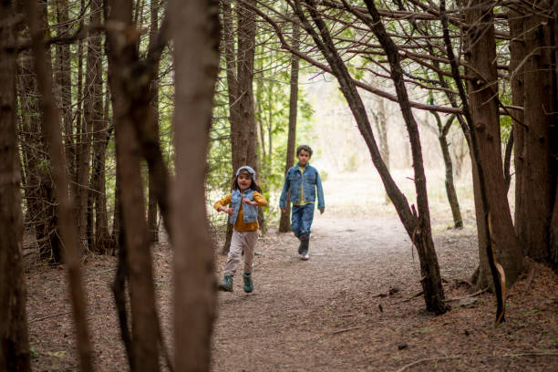 istock Kids in the forest 1221806631
