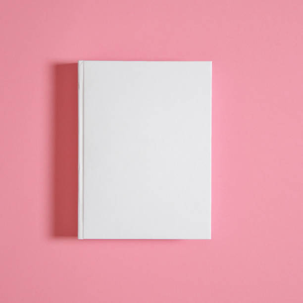 istock Mockup of closed blank square book at white textured paper 1221808551