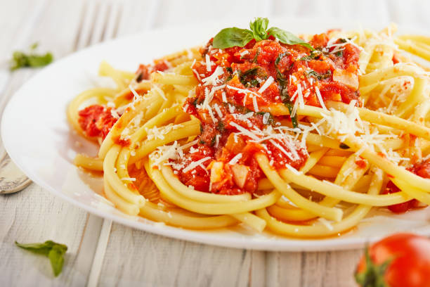 istock Tasty appetizing classic Italian spaghetti pasta with tomato sauce 1221811701