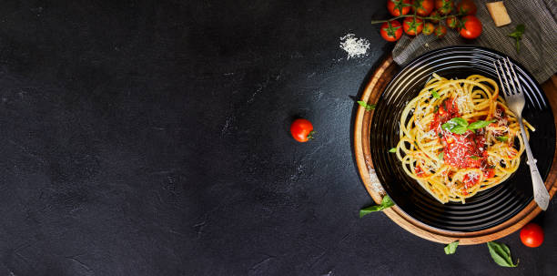 istock Tasty appetizing classic Italian pasta spaghetti with tomato sauce 1221811812