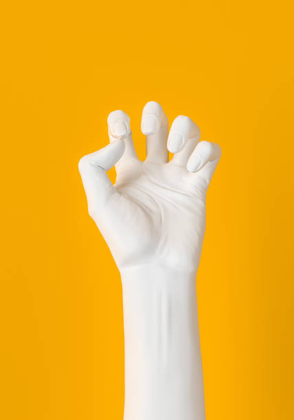 istock White Hand squeeze gesture isolated on yellow. Female hand sculpture 3d rendering. 1221812693