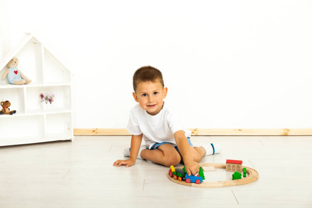 istock Boy playing with toys indoors at home 1221814652