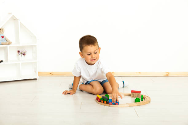 istock Boy playing with toys indoors at home 1221814674