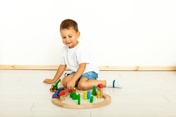 istock Boy playing with toys indoors at home 1221815489