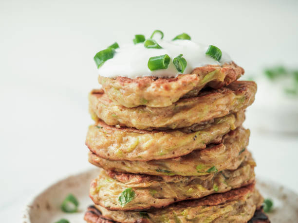 istock Traditional zucchini fritters, served sour cream 1221818191