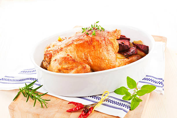 istock Delicious chicken with fresh herbs and vegetables. 122181846