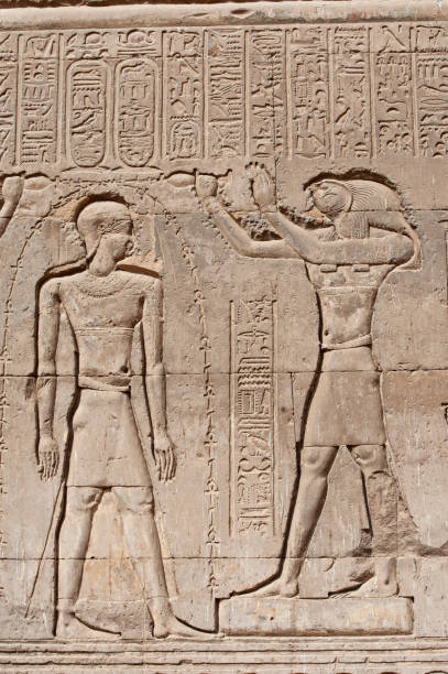 istock Hieroglyphic carvings on an ancient egyptian temple wall 1221819016
