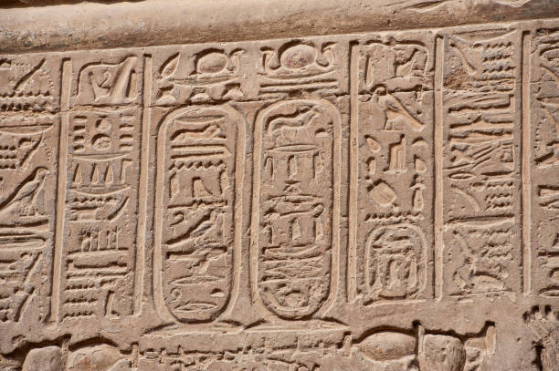 istock Hieroglyphic carvings on an ancient egyptian temple wall 1221819337