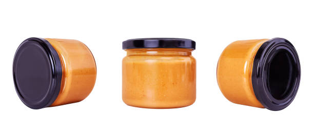 istock Peanut, almond paste in glass jar. Isolated. 1221819432