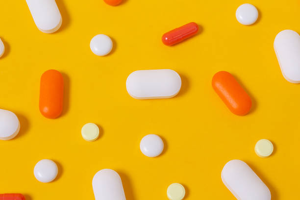 istock Vitamins for energy yellow background. Close up. 1221819433