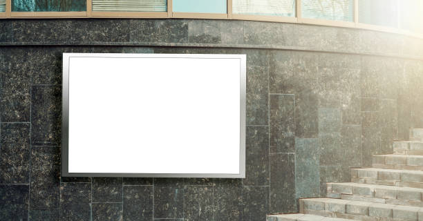 istock blank mock-up panel with space for design with metal frame on grey wall by steps 1221820753