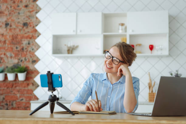 istock Woman watching her friends online 1221821406